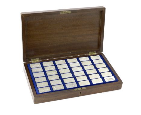 A wooden-cased set of 36 sterling silver commemorative motoring ingots by John Pinches, British, 1970s,36 ingots, produced in