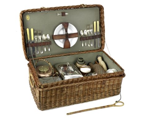 A wicker-cased 'Coracle' picnic set for four persons, by G.W.Scott &amp; Sons, circa 1905,the wicker case with handles and lo