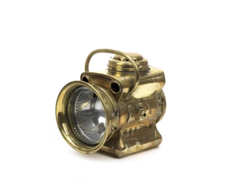 A Powell &amp; Hanmer model No.324 self-generating acetylene motor head lamp, British, Edwardian,brass body with carrying han