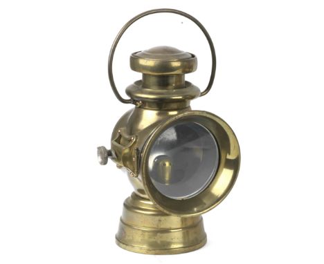 A Lucas No 742 oil illuminated lamp, circa 1910,left hand side lamp, brass bodied, with tiered chimney, loop handle, 4 inch d