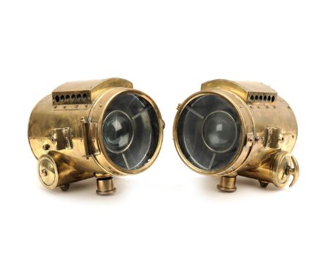 A good pair of 'Autoclipse' self-generating acetylene headlamps, circa 1907, CIRCA 1907,each lamp fork-mounted brass body wit