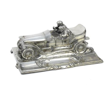 A motoring inkwell desk-piece by Wurtembergische Metallwaren Fabrik, German, circa 1912,marked 'WMF' at one of the integrated