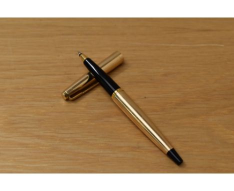 A Parker 45 Insignia CT rollerball pen in gold fill with black tassie