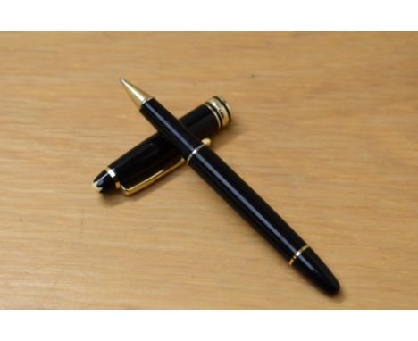 A Montblanc Meisterstuck Pix roller ball pen in black with gold trim