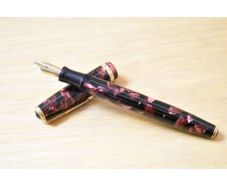 A Parker Duofold button fill fountain pen in red and black marble with broad Duofold cap band having Parker Duofold 14K Pen N
