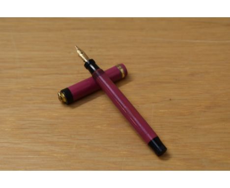 A Parker Lucky Curve Lady button fill fountain pen in magenta with single band to ring top cap having Parker Lucky Curve Pen 