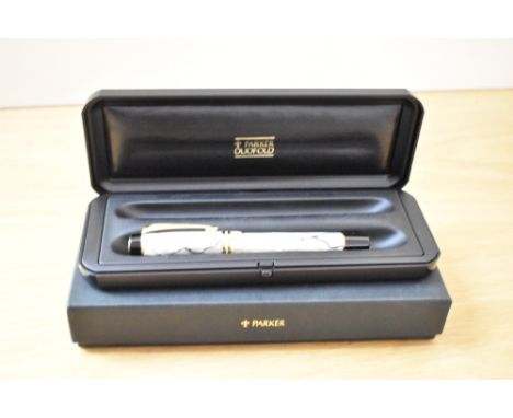 A boxed Parker Centenial MKII converter/Cartridge fill fountain pen in pearl and black with two cap bands having a Parker 18K