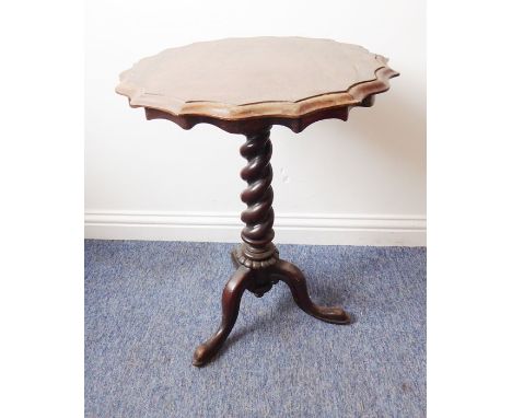 A mid-19th century rosewood occasional table; the thumbnail-moulded scallop-edged top above a tapering stem and raised on tri