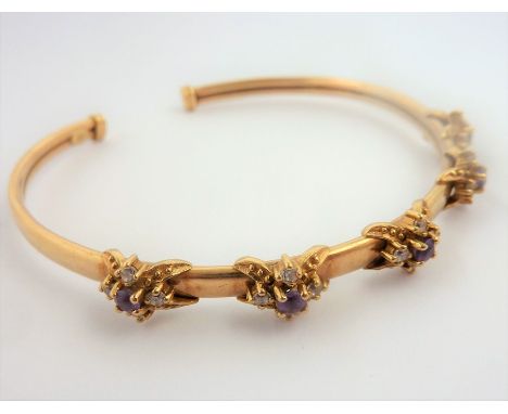 A 9-carat gold bangle set with amethyst and CZ clusters&nbsp;(total weight 9.15g)&nbsp;(The cost of&nbsp;UK postage&nbsp;via 
