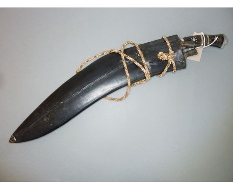 A large Indian Gurkha-style knife and scabbard with two skinning knives