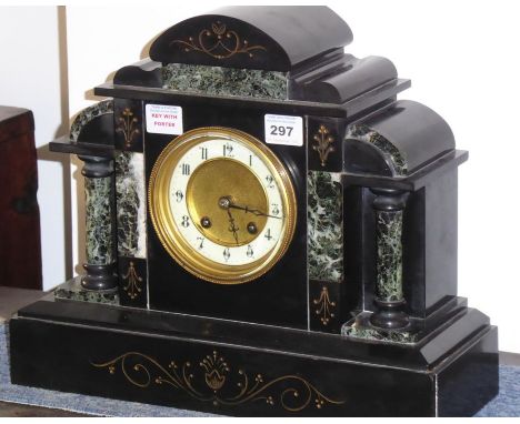 A late 19th century slate and marble mantel clock of architectural form; the cream chapter ring with Arabic numerals and flan