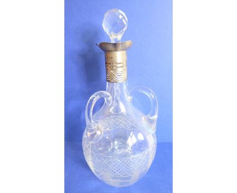 A late 19th / early 20th century Belgian Val St Lambert decanter; having three handles and hallmarked silver collar with circ