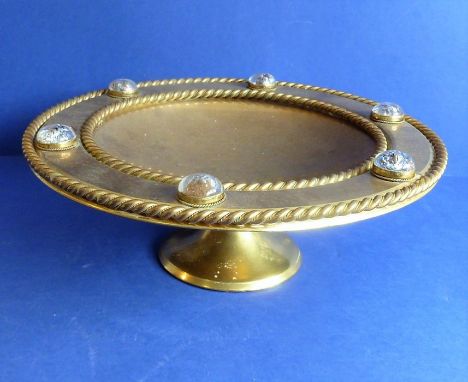 A 19th century heavy gilt-metal (probably gilt-bronze) circular pedestal dish; central engraved armorial and the rope-style b