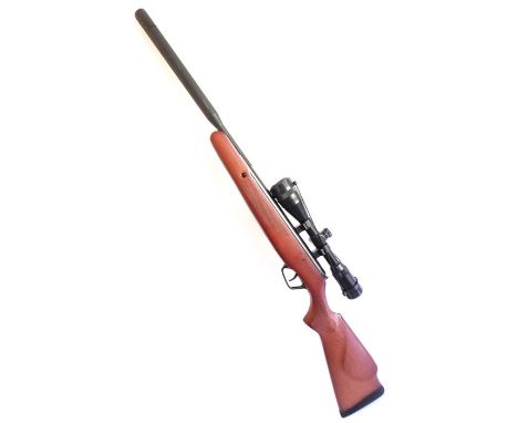 A .22 Stoeger air rifle; marked STG1411940 model X20 Suppressor, complete with telescopic sight, 2 tins of precision pellets 