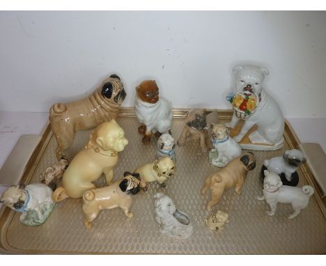 Sixteen, mostly small, decorative ceramic pug dogs and bulldogs to include a 19th century 'basket' exampleThe Auctioneers sta