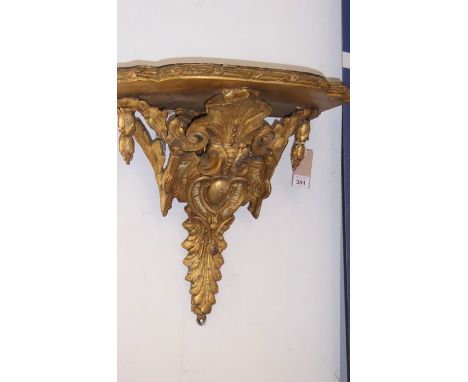 A 19th century ormolu-shaped shelf bracket ornately carved in original condition (45cm wide x 40cm x 28cm deep)