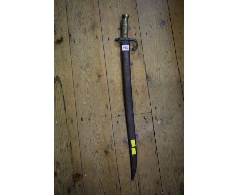 A French bayonet and steel scabbard, the blade inscribed and dated 1873, total length 72cm. 