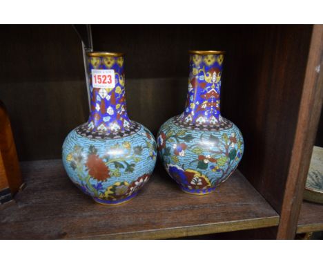 A pair of Chinese cloisonne enamel vases, 20.5cm high, (one dented).