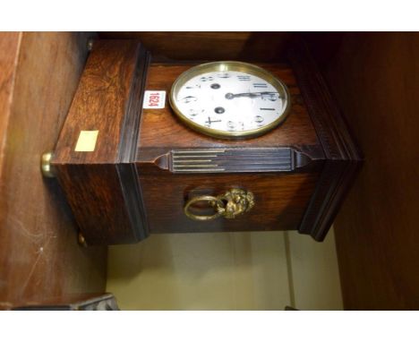 A late 19th century rosewood mantel clock, with brass lion mask side handles, 28cm high.