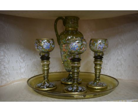 A Continental green glass and coloured enamel jug, tray and three goblets, the jug 29.5cm high.   Condition Report:  No sign 