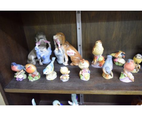 Nine Royal Worcester birds; together with a pair of Continental dogs; and another bird model. 