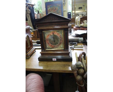 A late 19th century carved walnut architectural mantel clock, 41cm high. 