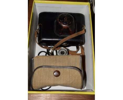 Cameras: a Zorki 4 camera, in leather case; together with a Kodak Brownie 127.