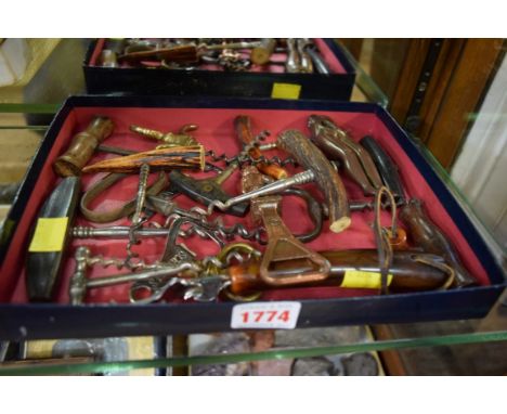 A collection of vintage corkscrews; together with a novelty leg nutcracker. 
