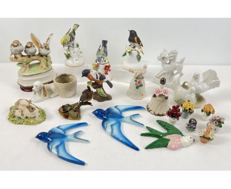 A box of assorted vintage ceramics to include birds, bells and miniature floral ornaments. 