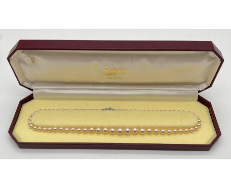 A boxed 16" string of vintage Lotus pearls with 925 silver clasp. 