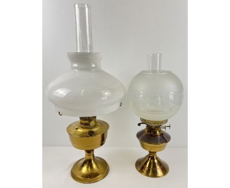 2 vintage brass based oil lamps with glass shades and chimneys. Largest approx. 60cm tall  (with chimney). 