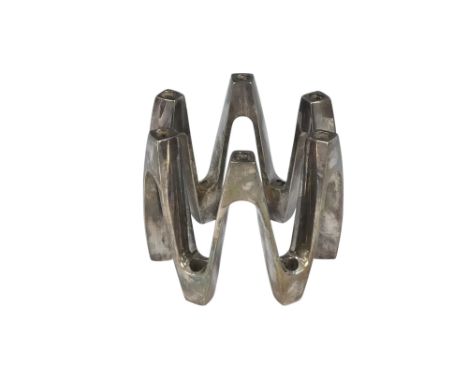 Jens Quistgaard for Dansk Designs - a silver plated annular candlestick of zig-zag form, for twelve tapers, 8cm high.