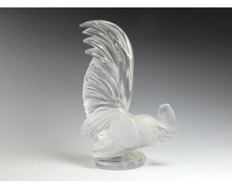 A late 20th century Lalique crystal cockerel - with its tail raised, etched Lalique mark to base, 21cm high.