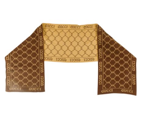 A Gucci scarf - bronze and brown with corporate branding, 160 x 30cm.