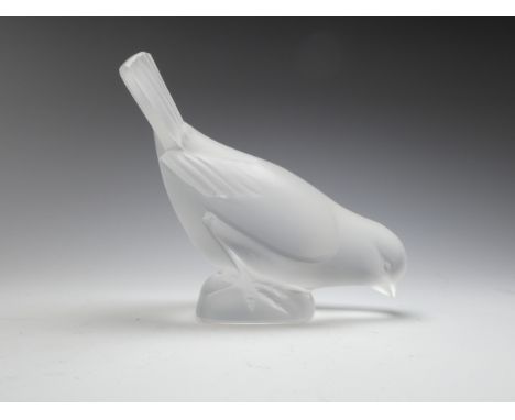 A late 20th century Lalique satin crystal bird - with head lowered, etched Lalique mark to base, 10cm high.