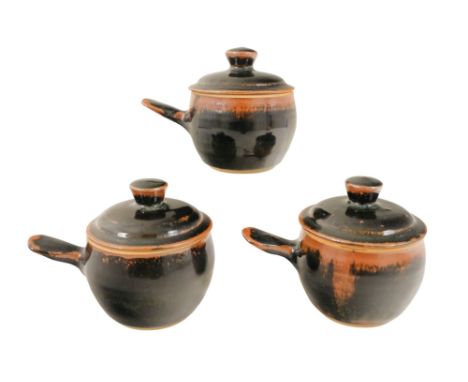 Michael CARDEW (British 1901-1983) three lidded soup cups - decorated in tenmoku glazes with impressed marks to base. (3)