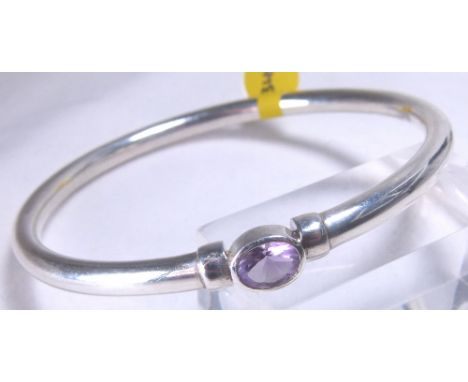 SLAVE BANGLE. Sterling silver slave bangle set with amethyst