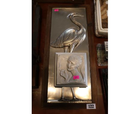 Framed White Metal plaque depicting a Stork and a Sand Cast British Empire Exhibition Wembley 1924 Cigarette box by R W Coan 