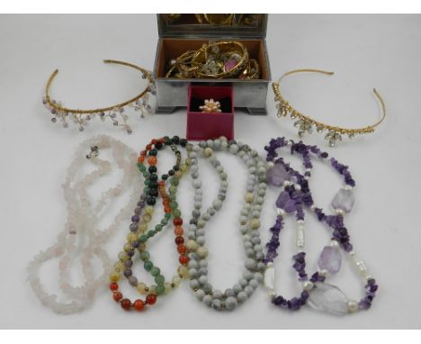 A quantity of costume jewellery, to include an amethyst tiara, a Rosa Monckton ring, beaded necklaces and another tiara.