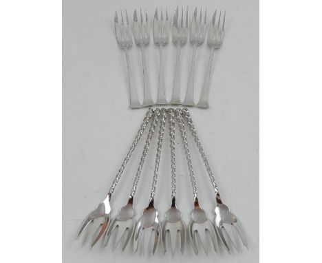 A set of six silver cake forks, Sheffield 1943, together with another set of forks stamped Sterling, 5ozt.