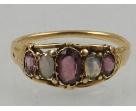 A yellow metal, amethyst and opal graduated five stone ring. 