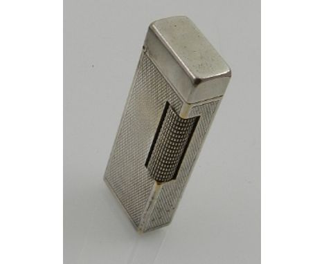 A silver plated Dunhill Rollagas lighter, rectangular with engine-turned body, H. 6.5cm.