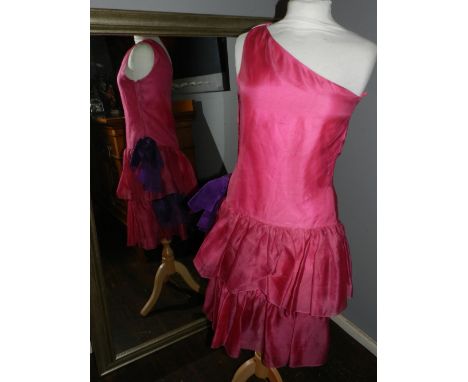 A 1980s Christian Dior pink and purple ladies one shouldered evening dress.