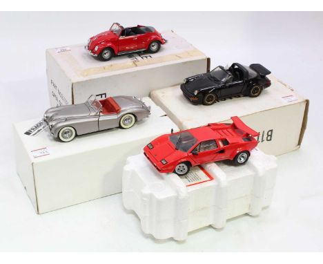 A collection of four various boxed Franklin Mint and Danbury Mint 1/24 scale diecast vehicles including a 1967 Volkswagen Bee