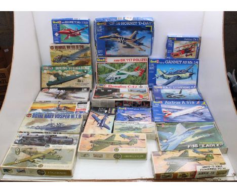 Two boxes containing a collection of various scale plastic military and aircraft kits to include Airfix, Revell, and similar,