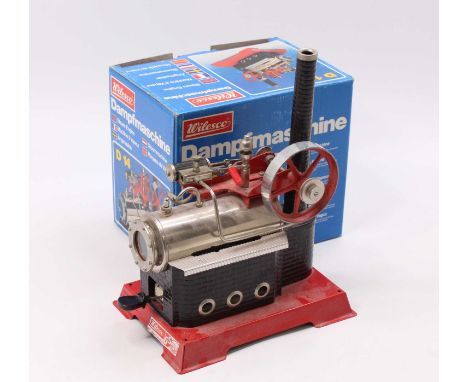 A Wilesco D14 Stationary horizontal steam engine red and black example, the model is dusty from being on display, as issued i