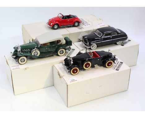 A collection of four various boxed Danbury Mint and Franklin Mint 1/24 scale diecast vehicles to include a 1932 V16 Cadillac 