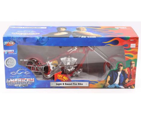A Joyride Collectables diecast model of a light and sound Fire Bike, as seen on American Chopper the series, housed in the or