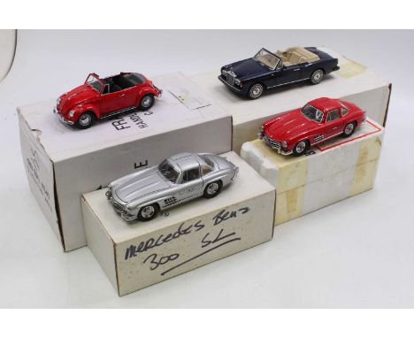 A collection of four boxed Danbury and Franklin Mint diecasts, all 1/24 scale, to include a 1967 Volkswagen Cabriolet, a Fran