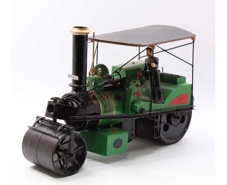 A scratch-built and battery-operated model of a Robey live steam roller traction engine finished in green with gold banding a